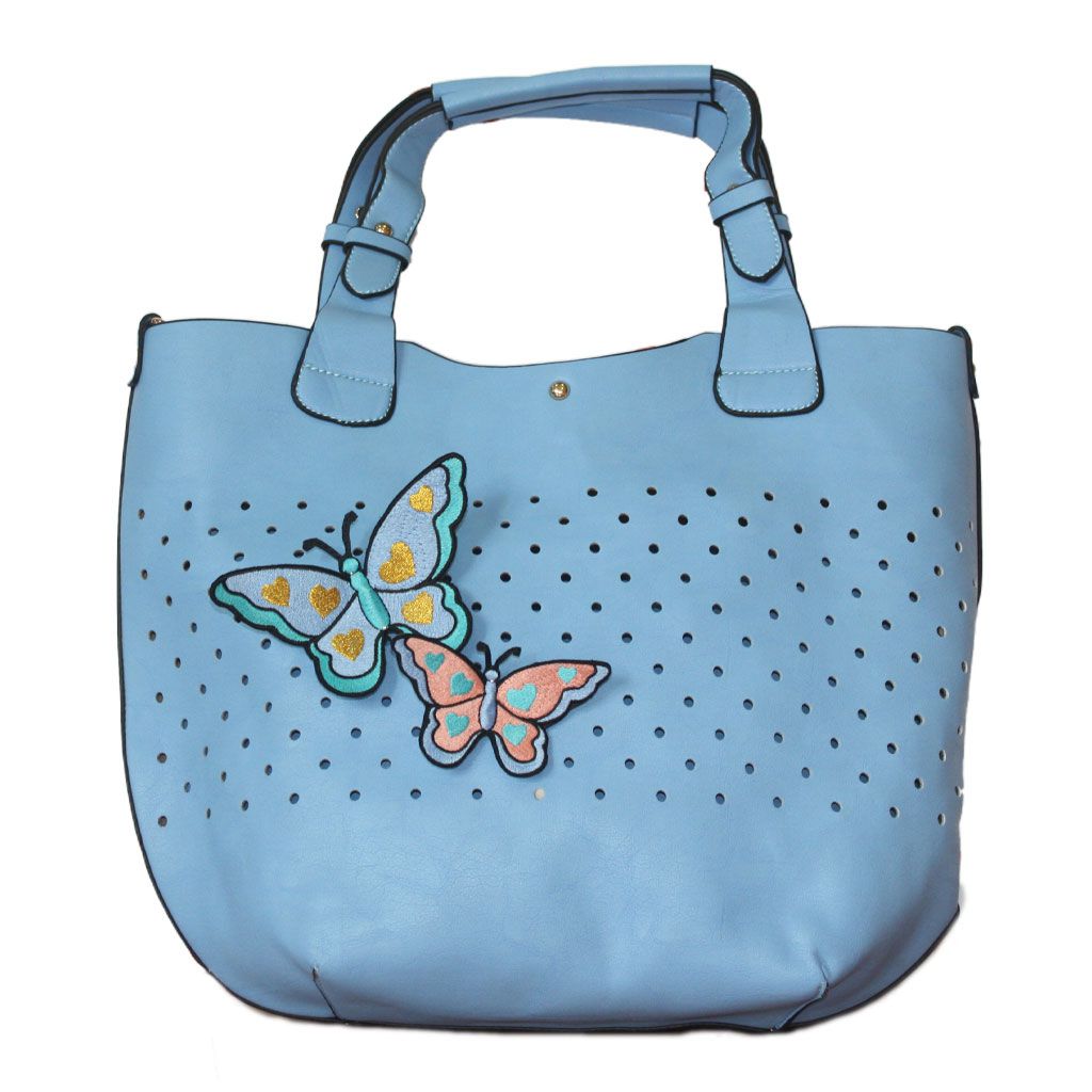 Parche creativo de mariposas recortado y añadido a un bolso